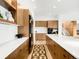 Chef's kitchen with high-end appliances, custom cabinetry, and a spacious center island at 1 S Forest St, Denver, CO 80246