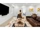 Modern living room featuring comfortable leather seating, stylish decor, and open access to other rooms at 1 S Forest St, Denver, CO 80246