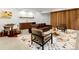 Inviting living room with leather furniture, a patterned rug, and a stylish bar area for entertaining at 1 S Forest St, Denver, CO 80246