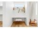 Cozy office nook with a built-in desk, shelving, and a unique stool creating a comfortable workspace at 1 S Forest St, Denver, CO 80246