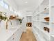 Well-organized pantry with ample shelving, storage, and a sink for added convenience at 1 S Forest St, Denver, CO 80246