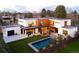 Modern home with a backyard oasis that includes a pool, patio, and manicured lawn at 1 S Forest St, Denver, CO 80246