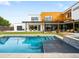 Modern home with a backyard oasis that includes a pool, patio, and manicured lawn at 1 S Forest St, Denver, CO 80246
