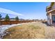 Spacious fenced backyard with a patio, perfect for outdoor entertaining and relaxation at 9335 Dunraven Loop, Arvada, CO 80007