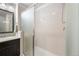 Bathroom featuring a glass enclosed shower and vanity with a large mirror at 9335 Dunraven Loop, Arvada, CO 80007