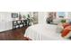 Bedroom with large windows, hardwood floors, plants, and decor around the bed at 9335 Dunraven Loop, Arvada, CO 80007
