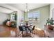 Dining area features seamless access to the living space and scenic views, ideal for gatherings at 9335 Dunraven Loop, Arvada, CO 80007