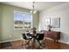 Cozy dining area with hardwood floors and natural light, perfect for intimate meals and gatherings at 9335 Dunraven Loop, Arvada, CO 80007