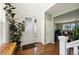 Bright foyer with hardwood floors, a view to the living room, and a staircase at 9335 Dunraven Loop, Arvada, CO 80007