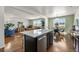 Open concept living space that combines living room, kitchen, and dining, perfect for modern living at 9335 Dunraven Loop, Arvada, CO 80007