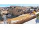 Lovely home showcasing a spacious backyard with a stone patio and privacy fence at 9335 Dunraven Loop, Arvada, CO 80007