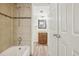 Bathroom with tub, shower, and vanity at 14190 E Temple Dr # O-04, Aurora, CO 80015