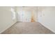 Spacious bedroom with carpet, door to bathroom and closet at 14190 E Temple Dr # O-04, Aurora, CO 80015