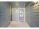 Exterior condo entryway with grey walls and a door at 14190 E Temple Dr # O-04, Aurora, CO 80015