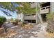 Exterior view of condo building entrance with walkway and landscaping at 14190 E Temple Dr # O-04, Aurora, CO 80015