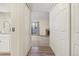 View down condo hallway with doors to bedrooms and living room at 14190 E Temple Dr # O-04, Aurora, CO 80015