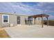 Backyard featuring a pergola and patio at 11595 Pass Me By Rd, Strasburg, CO 80136