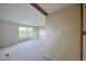 Neutral bedroom with carpeted floors and large windows for plenty of natural light at 11595 Pass Me By Rd, Strasburg, CO 80136