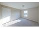 Bedroom with a window and white door at 11595 Pass Me By Rd, Strasburg, CO 80136