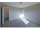 Bright bedroom with a door and carpet at 11595 Pass Me By Rd, Strasburg, CO 80136