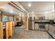 Modern kitchen with stainless steel appliances and tile floor at 28268 Shadow Mountain Dr, Conifer, CO 80433