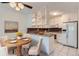 Bright kitchen with modern appliances and a cozy dining area at 6960 E Girard Ave # 105, Denver, CO 80224