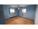 Bedroom with dual windows and ceiling fan at 2840 Wagner St, Strasburg, CO 80136