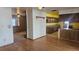 Dining room featuring hardwood floors with easy access to the living room and kitchen at 2840 Wagner St, Strasburg, CO 80136