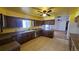 Kitchen with an eating space featuring lots of cabinets and lots of counter space at 2840 Wagner St, Strasburg, CO 80136