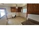 Utility kitchen with a ceiling fan and a window offering natural light at 2840 Wagner St, Strasburg, CO 80136