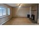 Cozy living room featuring a brick fireplace and large window for natural light at 2840 Wagner St, Strasburg, CO 80136