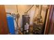 Utility room with water heater, furnace and well tank at 2840 Wagner St, Strasburg, CO 80136