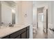 Modern bathroom featuring a sleek vanity with quartz countertop and contemporary fixtures at 635 Twilight St, Erie, CO 80516