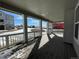 Covered porch with composite deck and view of neighborhood at 635 Twilight St, Erie, CO 80516