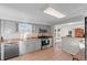 Updated kitchen with gray cabinets and stainless steel appliances at 695 S Oakland St, Aurora, CO 80012