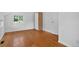 Spacious bedroom featuring wood floors, ample light from the window, and a built-in closet at 3429 Avenue D, Kittredge, CO 80457