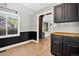 View of a dining room with black and white wainscotting and an adjacent living space at 3429 Avenue D, Kittredge, CO 80457