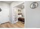 Bedroom view showcasing wood floors, a door and a view into the room at 1525 W 68Th Ave, Denver, CO 80221