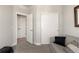 Bright secondary bedroom featuring closet, cozy couch and neutral-toned walls at 1525 W 68Th Ave, Denver, CO 80221