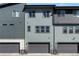 Modern townhouse featuring a two-car garage and contemporary color scheme at 1525 W 68Th Ave, Denver, CO 80221
