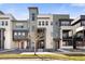 Modern townhouse complex with unique architectural details, sleek lines, and inviting entrances at 1525 W 68Th Ave, Denver, CO 80221