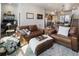 Spacious living room with a desk area and open floor plan, flowing into kitchen and dining at 1525 W 68Th Ave, Denver, CO 80221