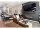 Inviting living room with a pool table, leather seating, and a cozy fireplace at 1525 W 68Th Ave, Denver, CO 80221