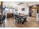 Open-concept living space with modern decor, dining area, and comfortable seating at 1525 W 68Th Ave, Denver, CO 80221