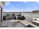Inviting rooftop deck with a hot tub, seating, and string lights, perfect for outdoor entertaining at 1525 W 68Th Ave, Denver, CO 80221