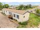 Exterior view of home with large yard and mature trees at 20995 County Road 28, Hudson, CO 80642