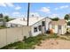 Exterior view of the property shows a white barn and a small shed under a cloudy sky at 20995 County Road 28, Hudson, CO 80642