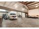 Spacious garage with vehicles and high ceilings at 20995 County Road 28, Hudson, CO 80642