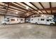 Spacious garage featuring three recreational vehicles indoors at 20995 County Road 28, Hudson, CO 80642
