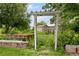 Backyard garden with wooden archway and shed at 20995 County Road 28, Hudson, CO 80642